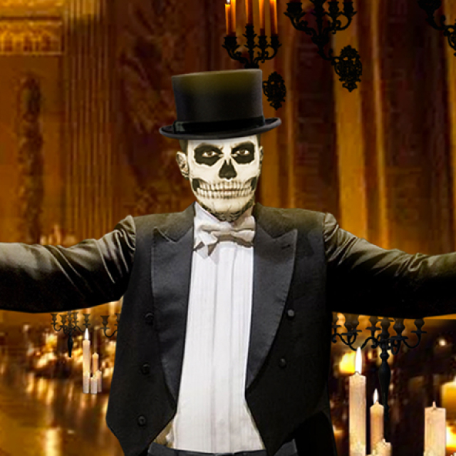 Promotional banner for The Rock Orchestra by Candlelight featuring a grand, candlelit concert hall with gothic décor. Numerous glowing candles, black candelabras, and skull accents frame the scene. At center-right, a conductor in formal attire and skeletal face makeup raises a baton with arms outstretched. The event title, “The Rock Orchestra by Candlelight,” appears prominently in large white text across the image.